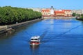 The city landscape, the tourist boat floats down the river Pregolya against the Fish village in Kaliningrad